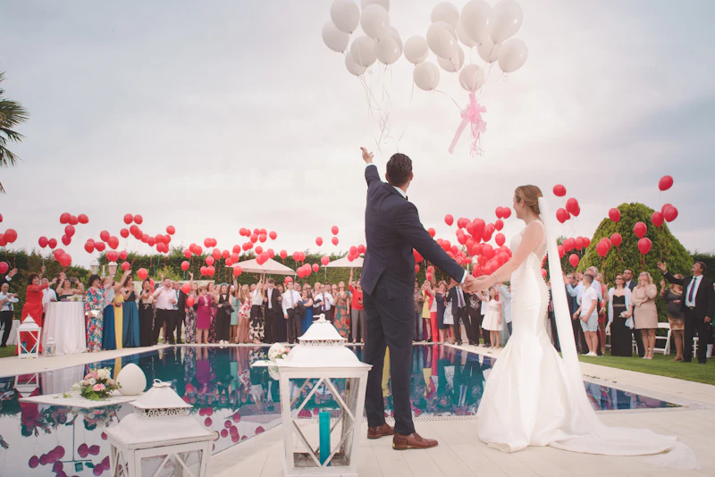 Couple dancing barefoot at an outdoor Austin summer wedding with string lights