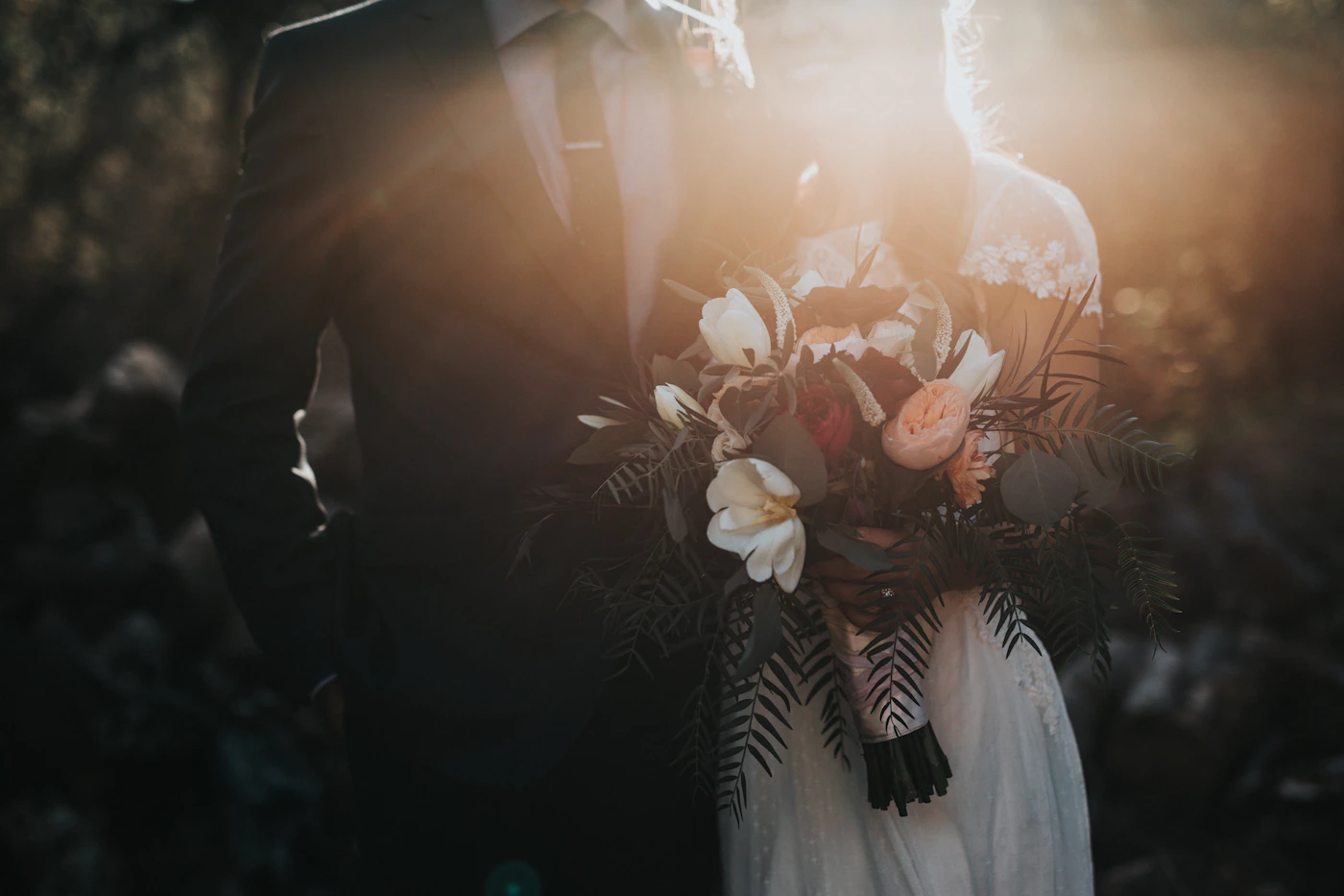 Bride and groom in golden hour light at a California vineyard wedding